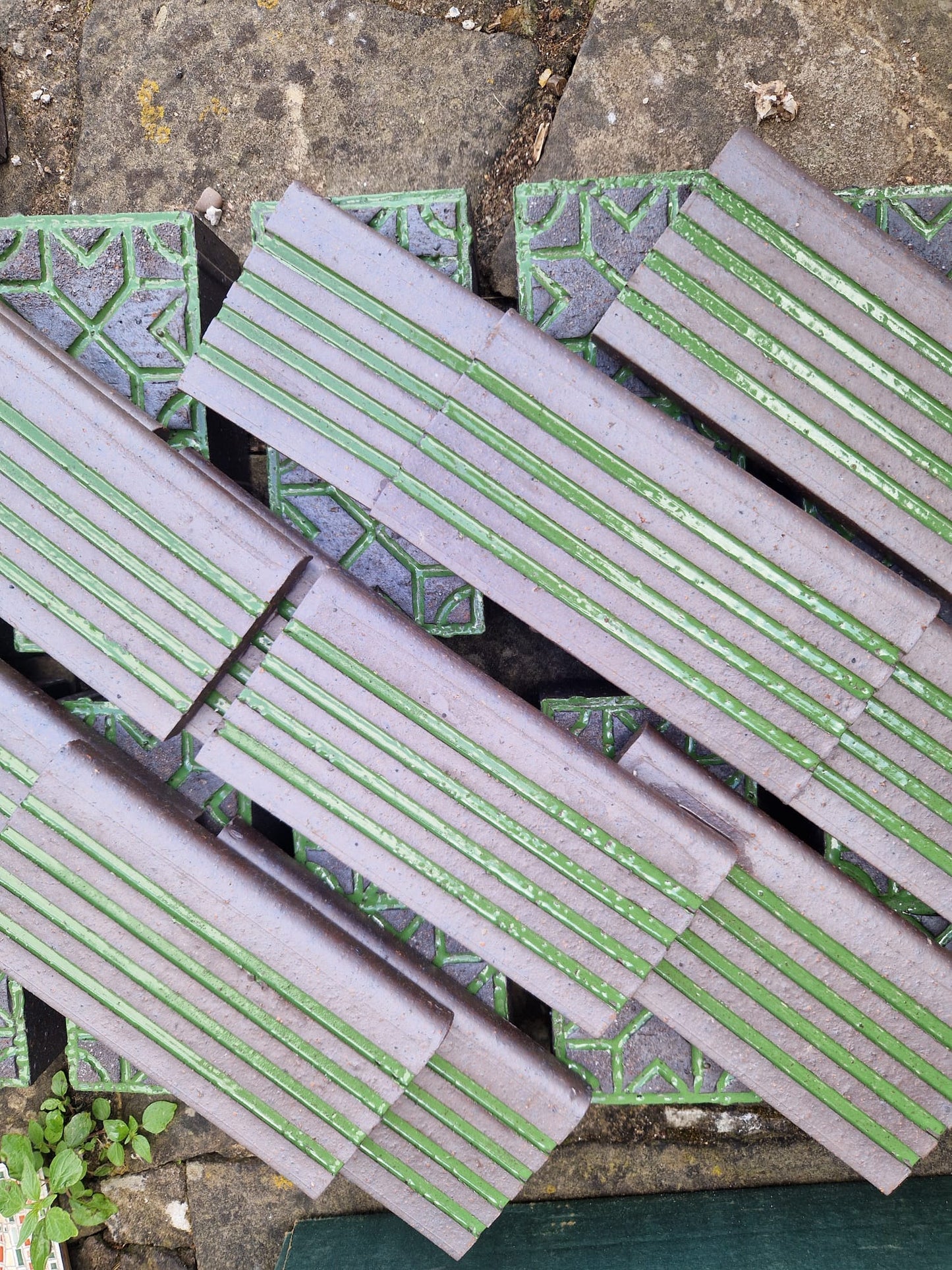 Fluted and ribbed glazed bricks stacked, seen from above